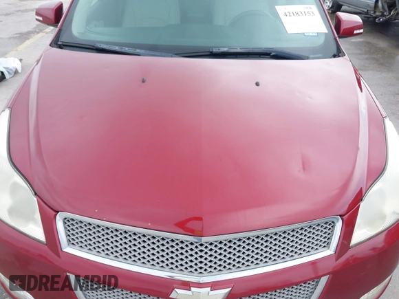 2011 Chevrolet Traverse LTZ z VIN 1GNKRLED6BJ142238, wystawiony jako IAAI lot #42183153 z przebiegiem 149 483 mil mil oraz . Historia ofert i sprzedaży dostępna na DreamBid. Obrazek 6.