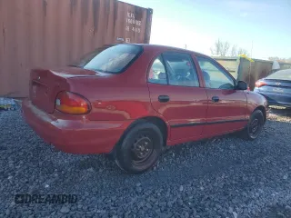 1997 Hyundai Accent z VIN KMHVF24N5VU369924, wystawiony jako Copart lot #85036114 z przebiegiem 168 797 mil mil oraz Szkody całkowita. Historia ofert i sprzedaży dostępna na DreamBid. Obrazek 3.