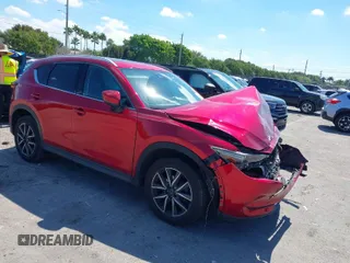 2018 Mazda CX-5 Grand Touring with VIN JM3KFADM0J0377091, listed as a IAAI auction lot 41677544 with 91,758 mi miles. Bid and sale history available at carsss.com. Image 1.