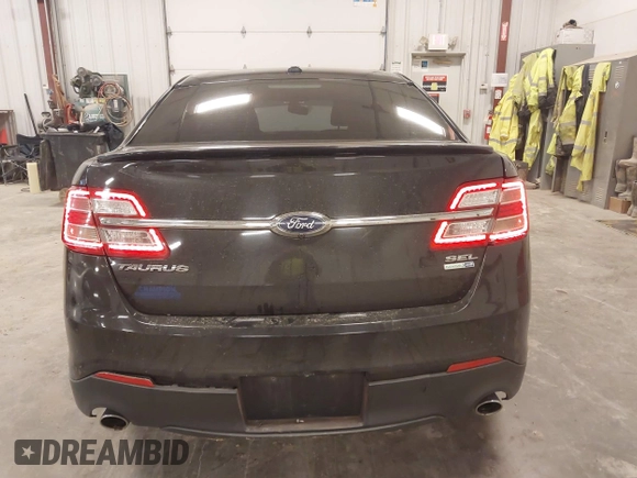 2015 Ford Taurus SEL with VIN 1FAHP2H80FG133240, listed as a IAAI auction lot 41897873 with 189,059 mi miles. Bid and sale history available at carsss.com. Image 16.