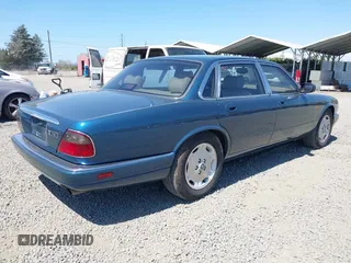 1996 Jaguar XJ with VIN SAJHX1740TC766425, listed as a IAAI auction lot 42758458 with 257,849 mi miles and . Bid and sale history available at DreamBid. Image 4.