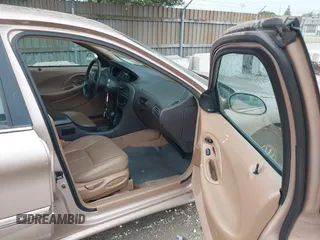 1996 Mercury Sable LS z VIN 1MELM53S1TG638988, wystawiony jako IAAI lot #42523616 z przebiegiem 87 087 mil mil oraz . Historia ofert i sprzedaży dostępna na DreamBid. Obrazek 5.