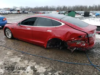 2017 Tesla Model S 100D with VIN 5YJSA1E29HF184387, listed as a Copart auction lot 39186144 with 101,387 mi miles and Salvage title. Bid and sale history available at DreamBid. Image 2.
