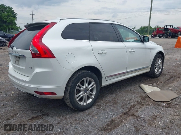 2015 Volvo XC60 T5 Drive-E Premier z VIN YV440MDB9F2622367, wystawiony jako IAAI lot #42356051 z przebiegiem 194 999 mil mil oraz . Historia ofert i sprzedaży dostępna na DreamBid. Obrazek 4.