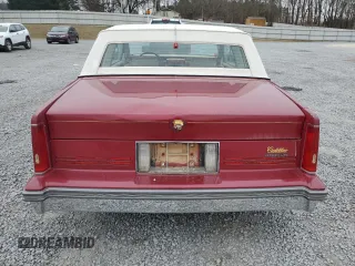1987 Cadillac DeVille z VIN 1G6CD1181H4318101, wystawiony jako Copart lot #75354324 z przebiegiem Nie podano mil oraz Szkoda całkowita • Salvage title. Historia ofert i sprzedaży dostępna na DreamBid. Obrazek 6.