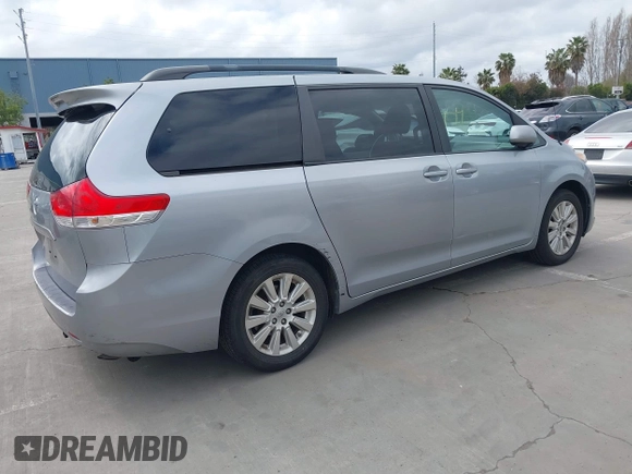 2014 Toyota Sienna LE with VIN 5TDJK3DC1ES080711, listed as a IAAI auction lot 41910679 with 118,788 mi miles and . Bid and sale history available at DreamBid. Image 4.