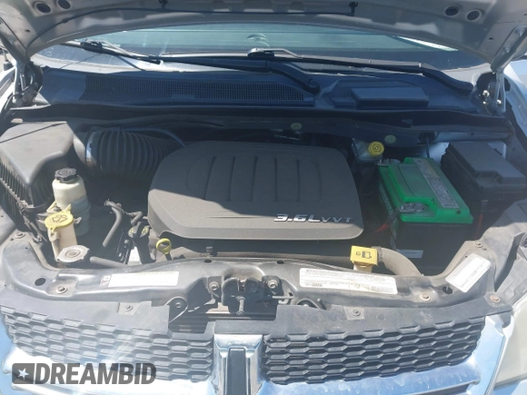 2012 Dodge Grand Caravan SXT with VIN 2C4RDGCG7CR204835, listed as a IAAI auction lot 41948688 with 125,466 mi miles and . Bid and sale history available at DreamBid. Image 10.