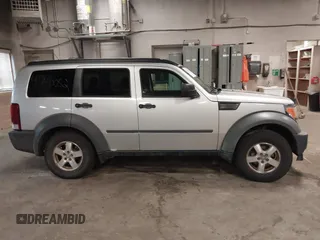 2007 Dodge Nitro SXT with VIN 1D8GU28K47W569317, listed as a IAAI auction lot 41740052 with 220,265 mi miles. Bid and sale history available at carsss.com. Image 13.