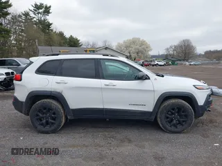 2016 Jeep Cherokee Trailhawk with VIN 1C4PJMBS7GW241076, listed as a IAAI auction lot 42020124 with 151,742 mi miles and . Bid and sale history available at DreamBid. Image 13.