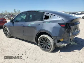 2023 Tesla Model Y Long Range z VIN 7SAYGDEE8PA185193, wystawiony jako Copart lot #48706215 z przebiegiem 10 451 mil mil oraz Szkoda całkowita • Salvage title. Historia ofert i sprzedaży dostępna na DreamBid. Obrazek 2.