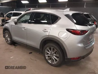 2021 Mazda CX-5 Grand Touring with VIN JM3KFBDM7M1392644, listed as a IAAI auction lot 41824612 with 80,000 mi miles and . Bid and sale history available at DreamBid. Image 3.