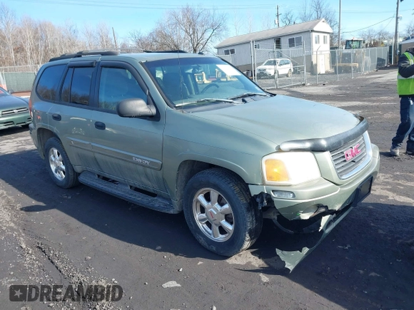 2004 GMC Envoy SLE with VIN 1GKDT13S942254932, listed as a IAAI auction lot 41509407 with 213,068 mi miles. Bid and sale history available at carsss.com. Image 1.