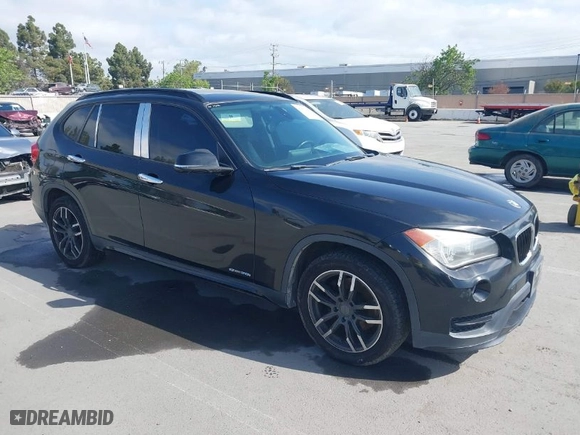 2015 BMW X1 sDrive28i with VIN WBAVM1C59FVW57928, listed as a IAAI auction lot 42056452 with 115,411 mi miles. Bid and sale history available at carsss.com. Image 1.