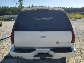 1999 Cadillac Escalade z VIN 1GYEK13R8XR411548, wystawiony jako Copart lot #75803424 z przebiegiem 277 712 mil mil oraz Szkody całkowita. Historia ofert i sprzedaży dostępna na DreamBid. Obrazek 6.