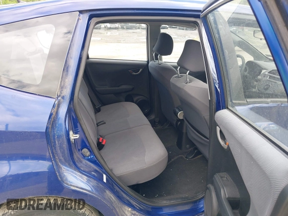 2009 Honda Fit with VIN JHMGE882X9S058976, listed as a IAAI auction lot 42202305 with 121,633 mi miles and . Bid and sale history available at DreamBid. Image 8.