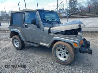 2004 Jeep Wrangler Sahara z VIN 1J4FA59S94P770777, wystawiony jako IAAI lot #41672971 z przebiegiem 167 280 mil mil oraz . Historia ofert i sprzedaży dostępna na DreamBid. Obrazek 1.