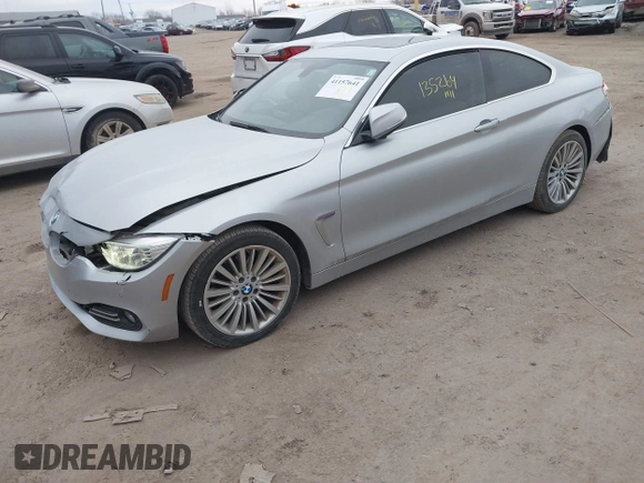 2014 BMW 4 Series 428i xDrive with VIN WBA3N5C53EF716542, listed as a IAAI auction lot 41157641 with 135,264 mi miles and . Bid and sale history available at DreamBid. Image 2.