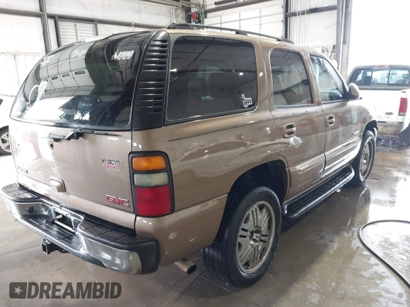 2004 GMC Yukon SLT with VIN 1GKEK13Z84R265500, listed as a IAAI auction lot 41412544 with 259,575 mi miles. Bid and sale history available at carsss.com. Image 4.