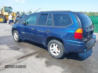 2004 GMC Envoy SLE with VIN 1GKDT13S242391968, listed as a IAAI auction lot 42079420 with 234,611 mi miles. Bid and sale history available at carsss.com. Image 3.
