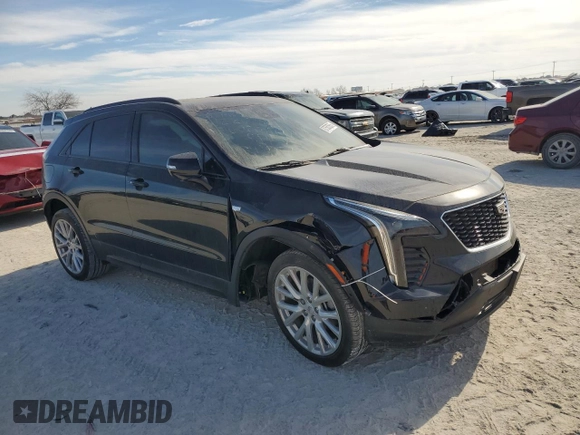2023 Cadillac XT4 FWD Sport with VIN 1GYFZER47PF107311, listed as a Copart auction lot 87583565 with 26,585 mi miles and Salvage title. Bid and sale history available at DreamBid. Image 4.