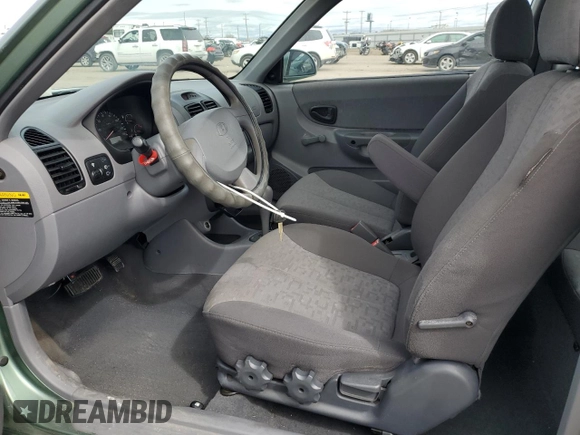 2003 Hyundai Accent GL with VIN KMHCG35C13U270585, listed as a Copart auction lot 50197935 with 53,822 mi miles and Salvage Title. Bid and sale history available at carsss.com. Image 7.