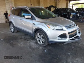 2016 Ford Escape Titanium with VIN 1FMCU9JX3GUB75889, listed as a IAAI auction lot 42188565 with 121,638 mi miles and . Bid and sale history available at DreamBid. Image 1.