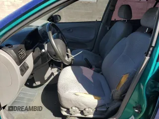 2002 Kia Rio with VIN KNADC123X26125297, listed as a Copart auction lot 74368764 with 72,025 mi miles and Salvage Title. Bid and sale history available at carsss.com. Image 7.