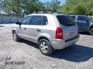 2006 Hyundai Tucson GL with VIN KM8JM12BX6U249982, listed as a IAAI auction lot 41976033 with 107,153 mi miles. Bid and sale history available at carsss.com. Image 3.