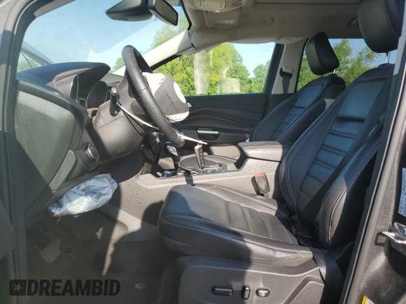 2019 Ford Escape Titanium with VIN 1FMCU0J96KUB22884, listed as a Copart auction lot 61979665 with 63,824 mi miles and Salvage title. Bid and sale history available at DreamBid. Image 7.