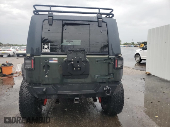 2012 Jeep Wrangler Unlimited Sport with VIN 1C4HJWDG8CL122067, listed as a Copart auction lot 58549805 with 124,658 mi miles and Clean title. Bid and sale history available at DreamBid. Image 6.