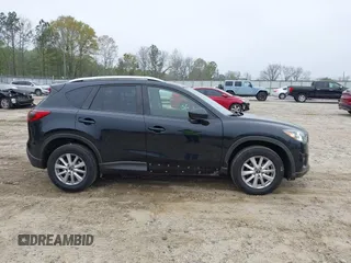 2014 Mazda CX-5 Touring with VIN JM3KE2CY7E0341658, listed as a IAAI auction lot 41915807 with 99,287 mi miles. Bid and sale history available at carsss.com. Image 6.