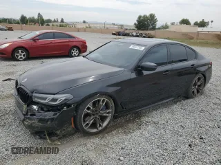 2022 BMW 5 Series M550i xDrive with VIN WBA13BK05NCK91943, listed as a Copart auction lot 58667205 with 21,209 mi miles and Salvage title. Bid and sale history available at DreamBid. Image 1.