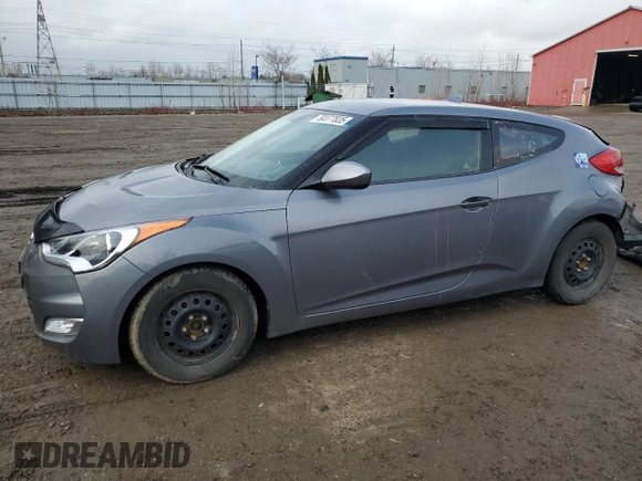 2012 Hyundai Veloster w/Black Int z VIN KMHTC6ADXCU025876, wystawiony jako Copart lot #50377835 z przebiegiem 185 181 mil mil oraz Czysty tytuł • Clean title. Historia ofert i sprzedaży dostępna na DreamBid. Obrazek 1.