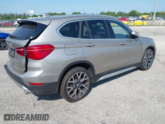 2021 BMW X1 sDrive28i z VIN WBXJG7C09M5U26043, wystawiony jako IAAI lot #36062187 z przebiegiem 14 844 mil mil oraz . Historia ofert i sprzedaży dostępna na DreamBid. Obrazek 4.