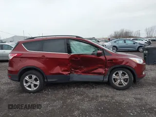 2016 Ford Escape SE with VIN 1FMCU9GX8GUB28820, listed as a IAAI auction lot 40874359 with 134,459 mi miles. Bid and sale history available at carsss.com. Image 13.
