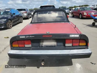 1988 Alfa Romeo Spider Graduate z VIN ZARBA5645J1062539, wystawiony jako Copart lot #75542014 z przebiegiem Nie podano mil oraz Szkody całkowita. Historia ofert i sprzedaży dostępna na DreamBid. Obrazek 6.