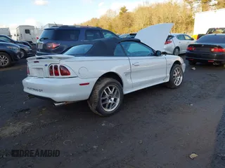 1996 Ford Mustang GT with VIN 1FALP45X7TF201553, listed as a IAAI auction lot 41487690 with 102,015 mi miles. Bid and sale history available at carsss.com. Image 4.