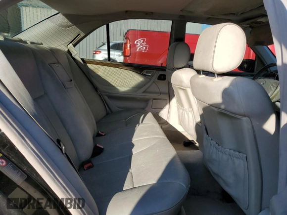 2002 Mercedes-Benz E-Class with VIN WDBJF65J32B494321, listed as a Copart auction lot 77557334 with 198,820 mi miles and Salvage Title. Bid and sale history available at carsss.com. Image 10.