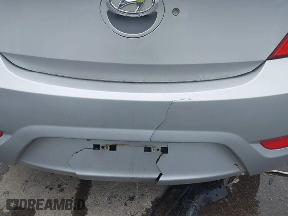 2012 Hyundai Accent SE z VIN KMHCU5AE0CU054285, wystawiony jako IAAI lot #42170678 z przebiegiem 92 172 mil mil oraz . Historia ofert i sprzedaży dostępna na DreamBid. Obrazek 12.