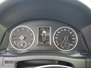 2013 Volkswagen Tiguan SE z VIN WVGBV7AXXDW534779, wystawiony jako Copart lot #77397164 z przebiegiem 149 285 mil mil oraz Szkoda całkowita • Salvage title. Historia ofert i sprzedaży dostępna na DreamBid. Obrazek 9.