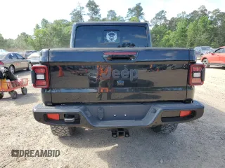 2023 Jeep Gladiator High Altitude z VIN 1C6HJTFG1PL591347, wystawiony jako Copart lot #52847825 z przebiegiem 9 854 mil mil oraz Szkoda całkowita • Salvage title. Historia ofert i sprzedaży dostępna na DreamBid. Obrazek 6.