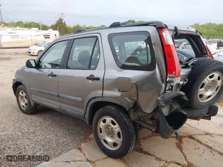 2006 Honda CR-V LX with VIN SHSRD68506U404787, listed as a IAAI auction lot 42001551 with 136,534 mi miles. Bid and sale history available at carsss.com. Image 3.