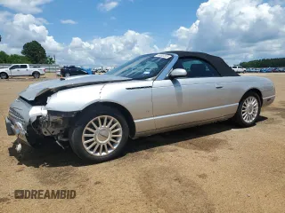 2004 Ford Thunderbird Deluxe z VIN 1FAHP60A04Y100445, wystawiony jako Copart lot #56583305 z przebiegiem 74 343 mil mil oraz Szkoda całkowita • Salvage title. Historia ofert i sprzedaży dostępna na DreamBid. Obrazek 1.