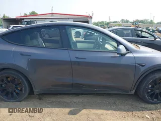 2021 Tesla Model Y Long Range z VIN 5YJYGDEE7MF140144, wystawiony jako IAAI lot #42350137 z przebiegiem Nie podano mil oraz . Historia ofert i sprzedaży dostępna na DreamBid. Obrazek 12.