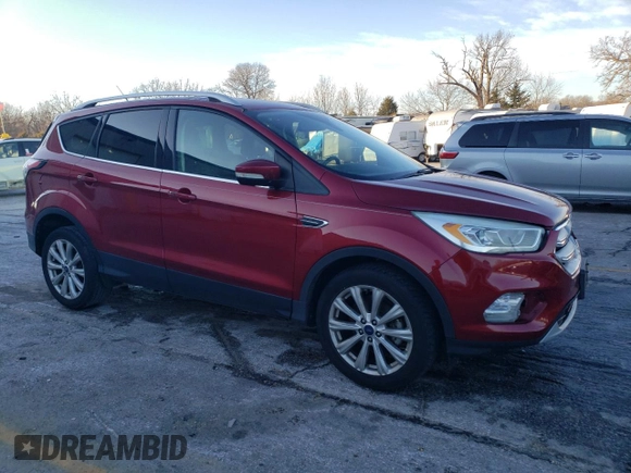 2017 Ford Escape Titanium with VIN 1FMCU0JD7HUD41107, listed as a Copart auction lot 85657084 with 197,982 mi miles and Salvage Title. Bid and sale history available at DreamBid. Image 4.