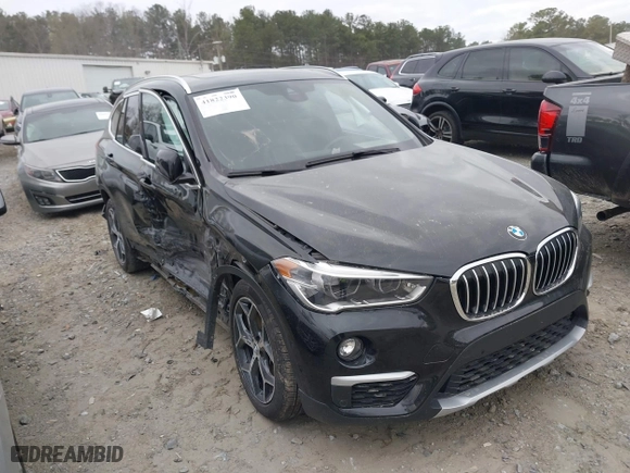 2018 BMW X1 xDrive28i with VIN WBXHT3C34J5K21576, listed as a IAAI auction lot 41822390 with 69,645 mi miles. Bid and sale history available at carsss.com. Image 1.