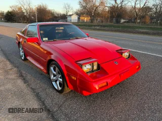 1986 Nissan 300ZX z VIN JN1HZ14S3GX148058, wystawiony jako Copart lot #48599395 z przebiegiem 233 738 mil mil oraz Czysty tytuł • Clean title. Historia ofert i sprzedaży dostępna na DreamBid. Obrazek 1.
