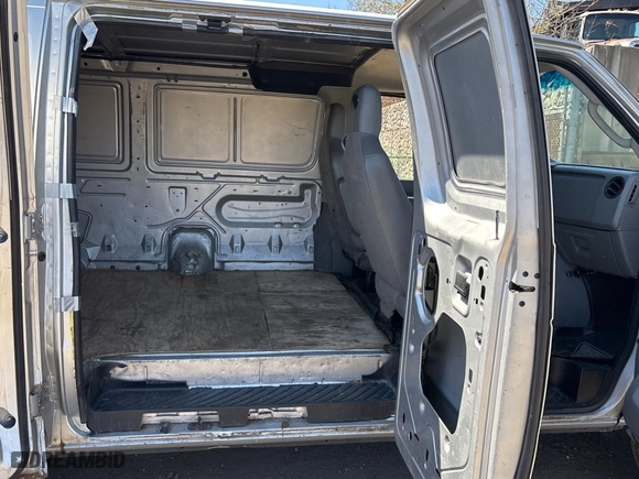 2012 Ford Econoline Cargo Van Recreational with VIN 1FTNE2EW4CDA37064, listed as a Copart auction lot 52738215 with 202,117 mi miles and Clean Title. Bid and sale history available at carsss.com. Image 6.