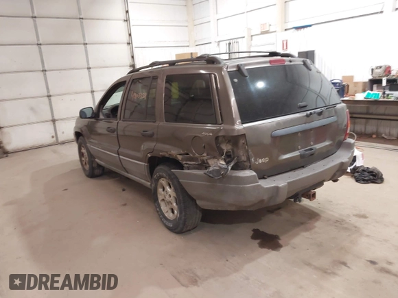 2000 Jeep Grand Cherokee Laredo z VIN 1J4GW48S1YC277710, wystawiony jako IAAI lot #42033564 z przebiegiem Nie podano mil oraz . Historia ofert i sprzedaży dostępna na DreamBid. Obrazek 3.