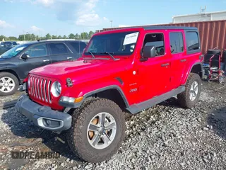 2020 Jeep Wrangler Unlimited Sahara High Altitude with VIN 1C4HJXEG2LW182641, listed as a IAAI auction lot 40130890 with 79,984 mi miles and . Bid and sale history available at DreamBid. Image 2.